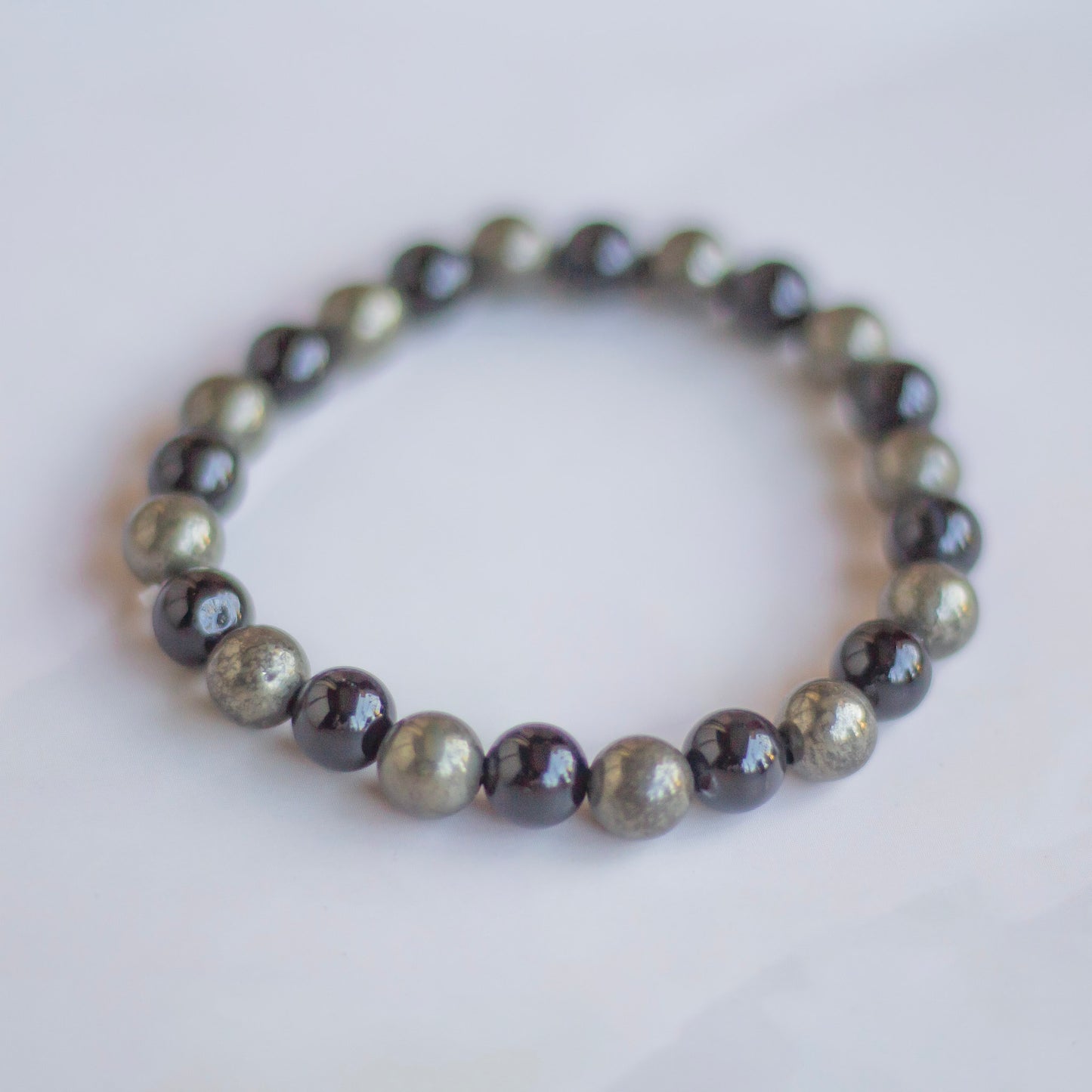 Bracelet associated with Abundance & Protection | Pyrite + Black Obsidian - 8mm