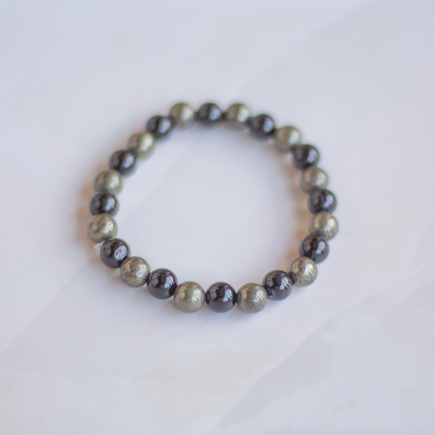 Bracelet associated with Abundance & Protection | Pyrite + Black Obsidian - 8mm