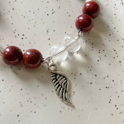 Bracelet associated with Clarity & Well-being | Red Jasper & Clear Quartz with Angel wing Charm