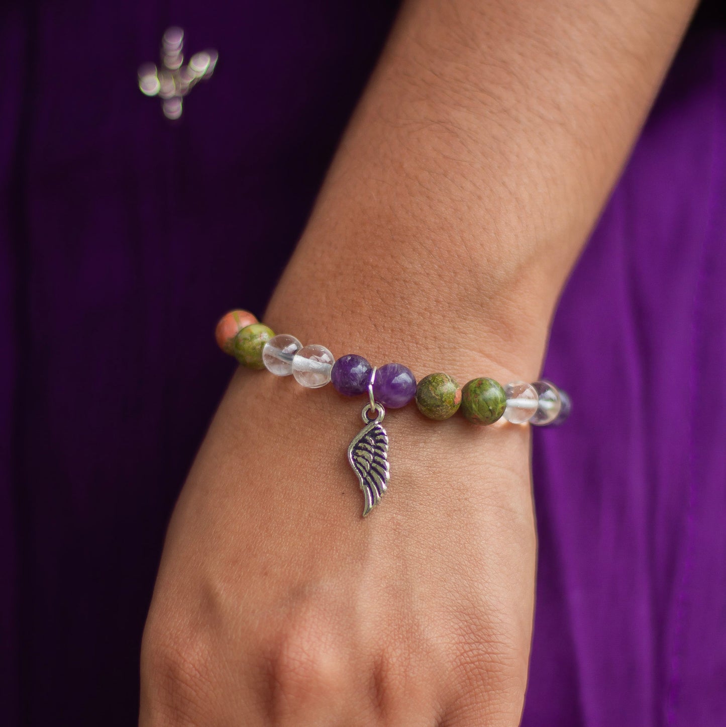 Bracelet associated with Personal Growth and overall healing | Unakite, Amethyst & Clear Quartz with angel wing charm