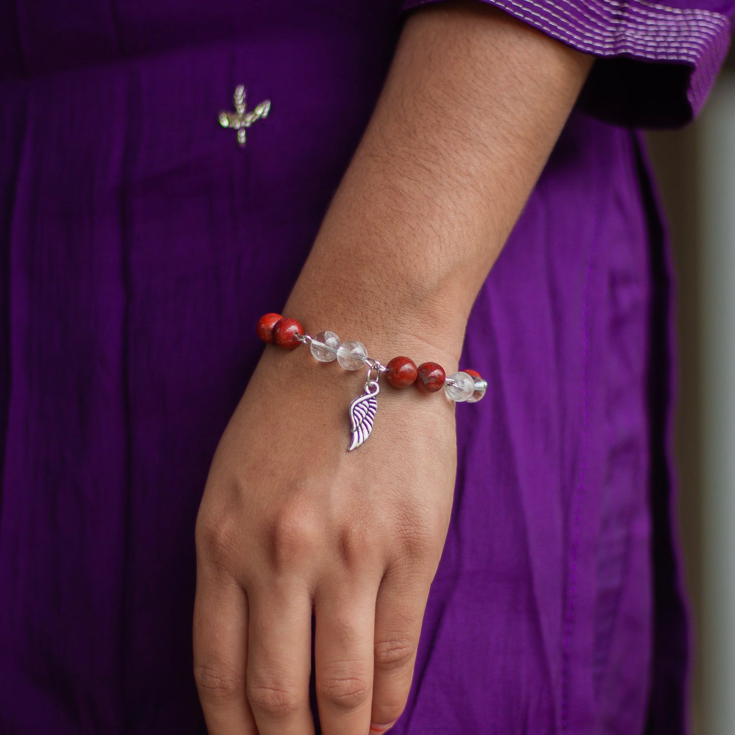 Bracelet associated with Clarity & Well-being | Red Jasper & Clear Quartz with Angel wing Charm