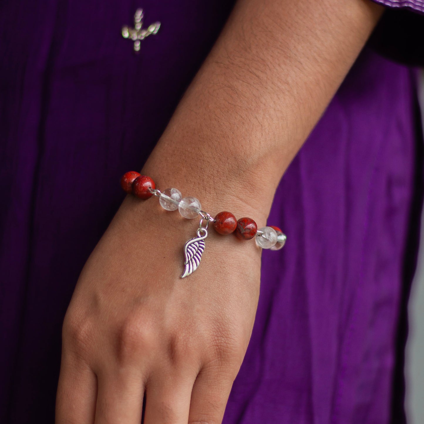 Bracelet associated with Clarity & Well-being | Red Jasper & Clear Quartz with Angel wing Charm