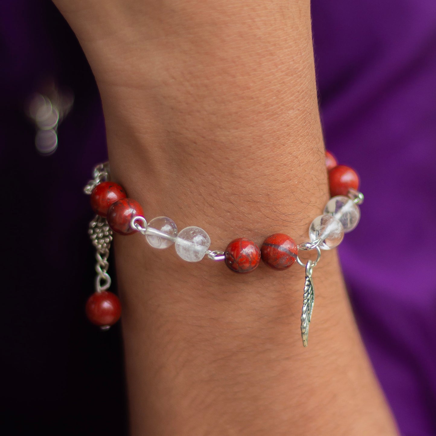 Bracelet associated with Clarity & Well-being | Red Jasper & Clear Quartz with Angel wing Charm